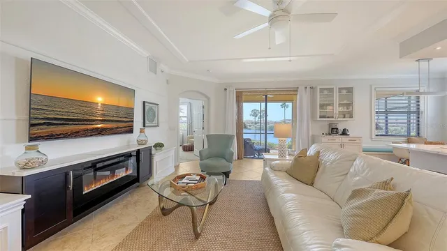 a kitchen with a dining table chairs refrigerator and cabinets