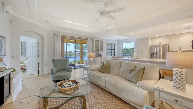 a kitchen with a sink and chairs