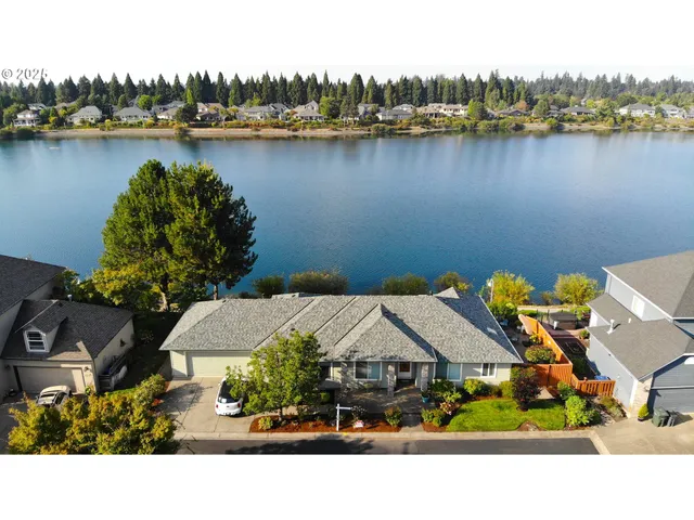 a picture of houses with outdoor space and lake view