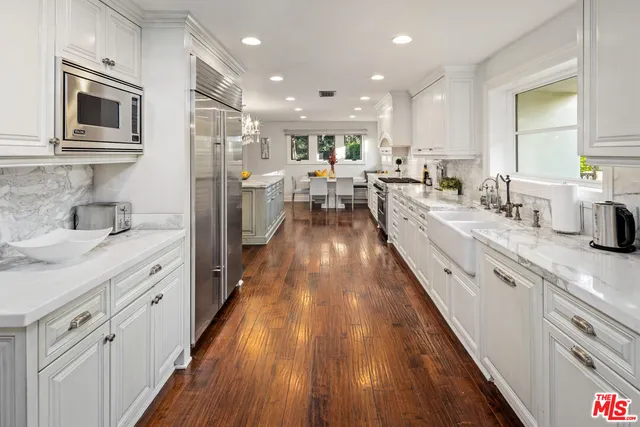 a large kitchen with cabinets