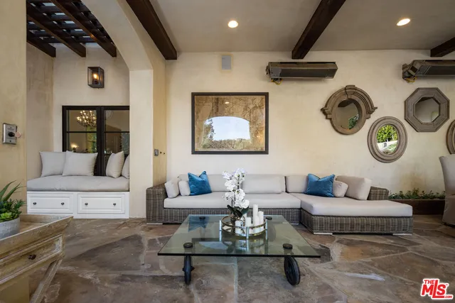 a living room with furniture and a clock