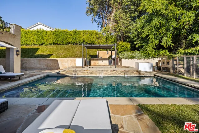 a view of swimming pool with a patio
