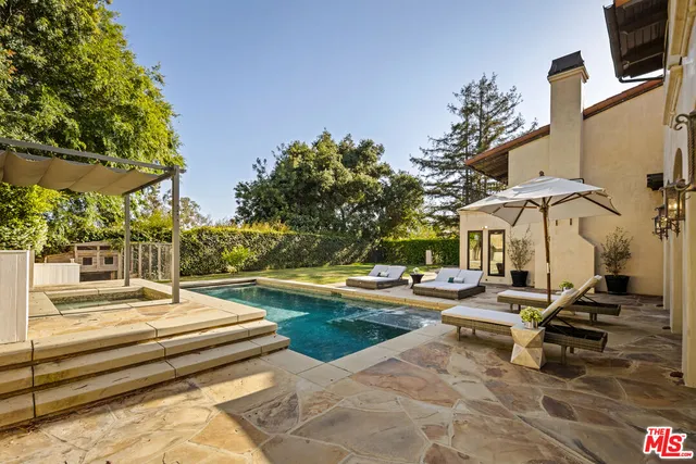 a view of patio with swimming pool