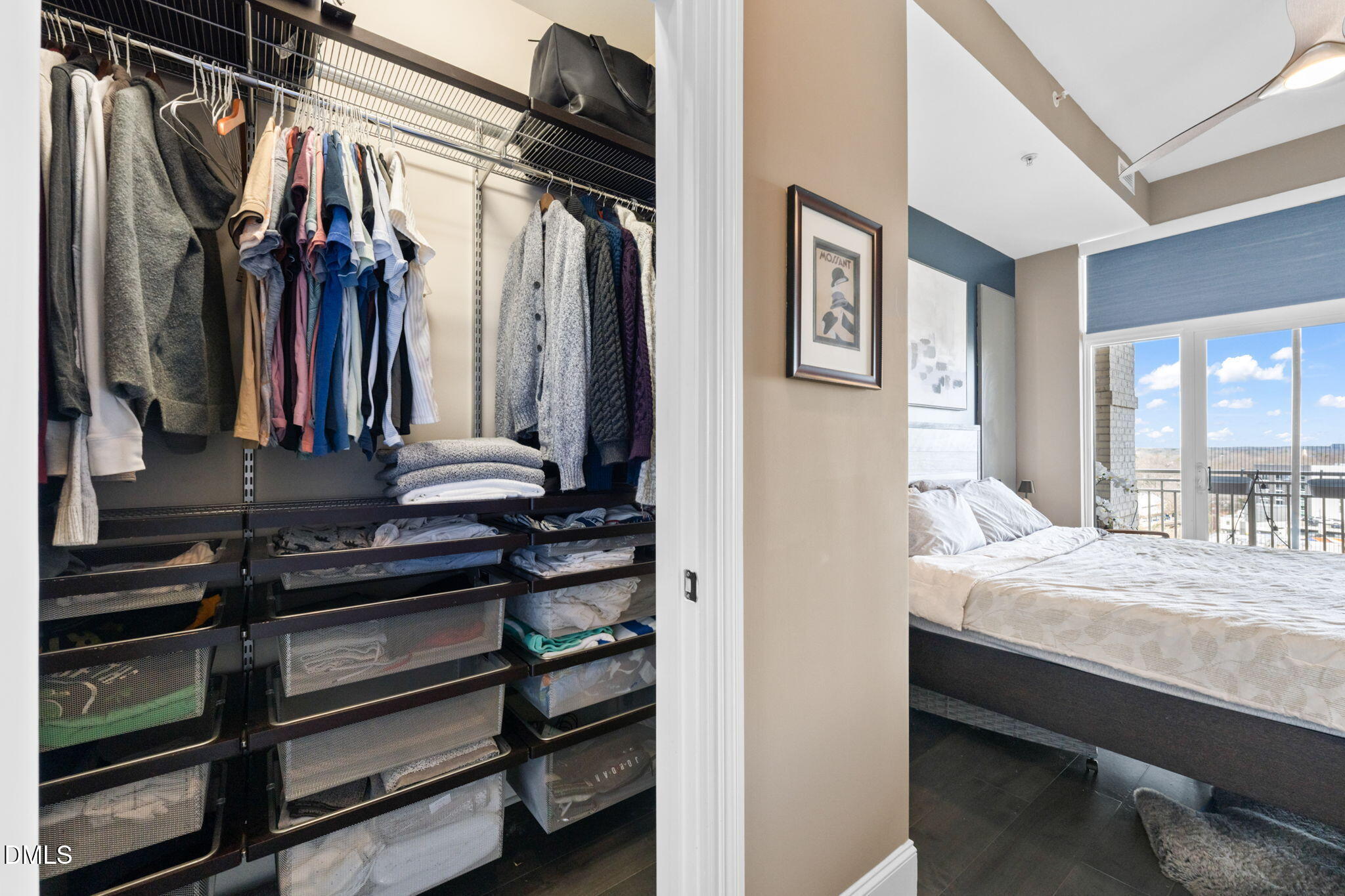 400 West North Street, Unit 1218 Raleigh, NC 27603 - Photo 21 of 41 a bedroom with a bed with the view of walk in closet