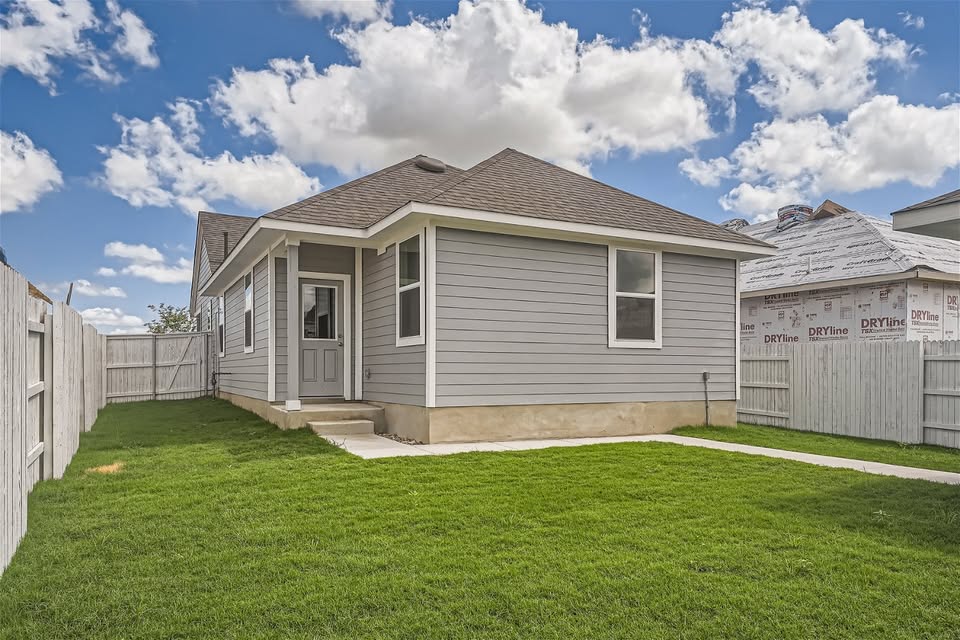 141 Bluestem Drive Elgin, TX 78621 - Photo 10 of 19 a view of a house with a yard and pathway