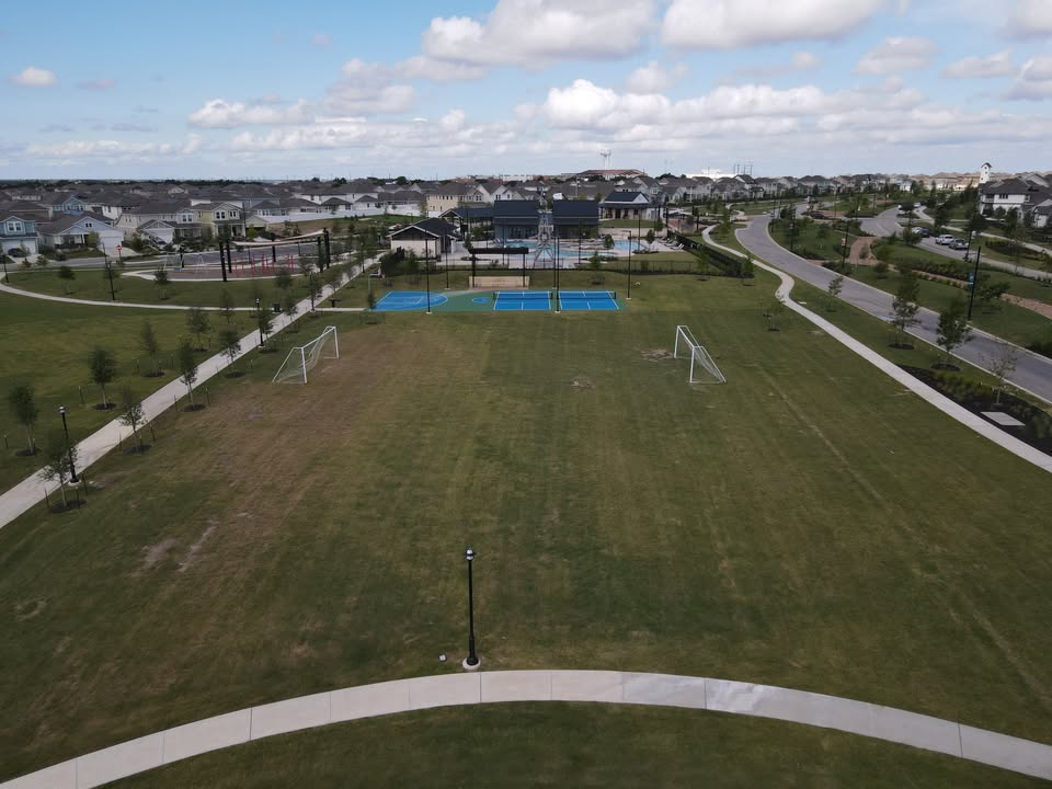 141 Bluestem Drive Elgin, TX 78621 - Photo 17 of 19 a view of a city