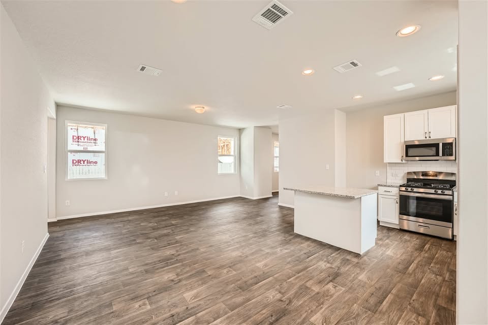 141 Bluestem Drive Elgin, TX 78621 - Photo 18 of 19 a view of kitchen with sink and refrigerator