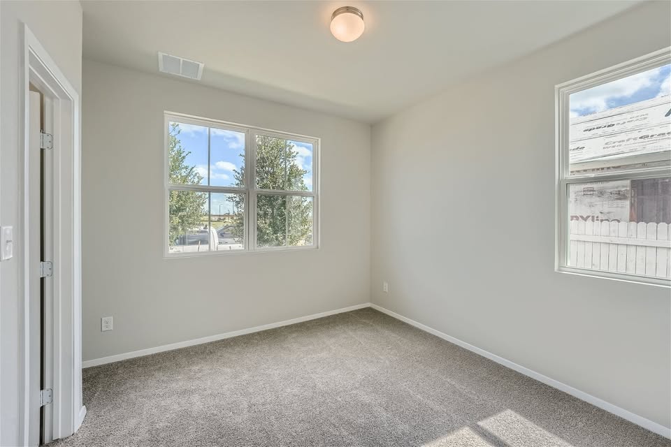 141 Bluestem Drive Elgin, TX 78621 - Photo 5 of 19 an empty room with a window