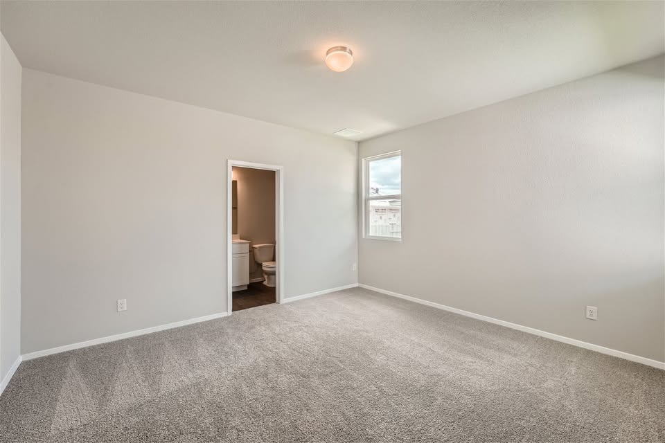 141 Bluestem Drive Elgin, TX 78621 - Photo 8 of 19 a view of an empty room with a window