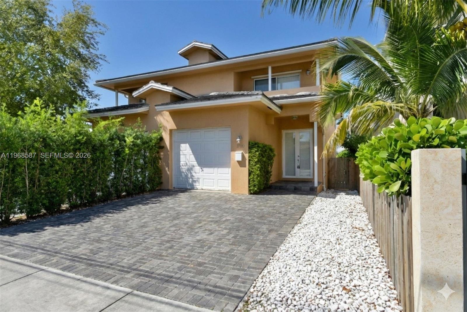a front view of a house with garden