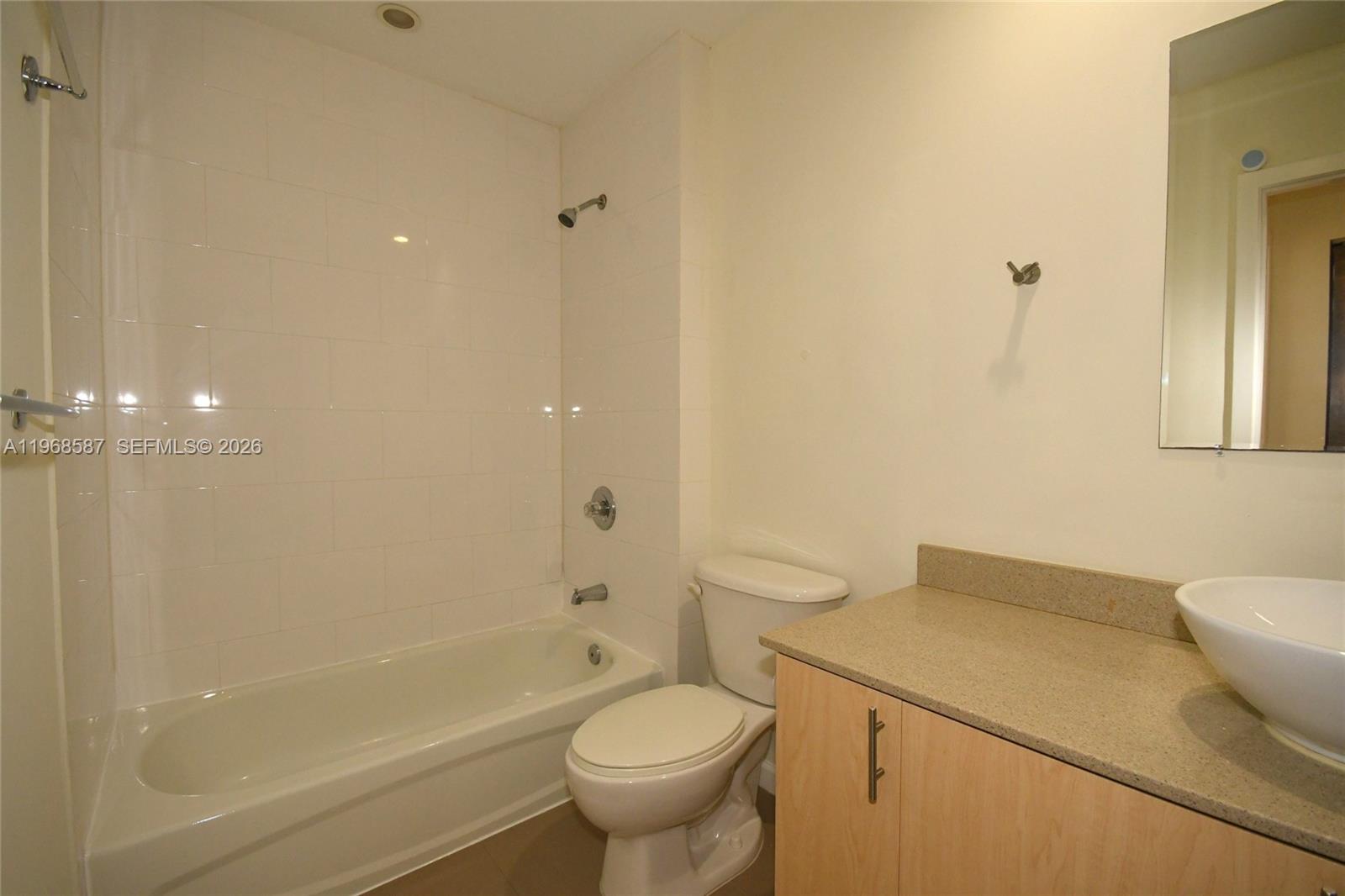 2780 Southwest 33rd Avenue Miami, FL 33133 - Photo 14 of 52 a bathroom with a sink a toilet and shower