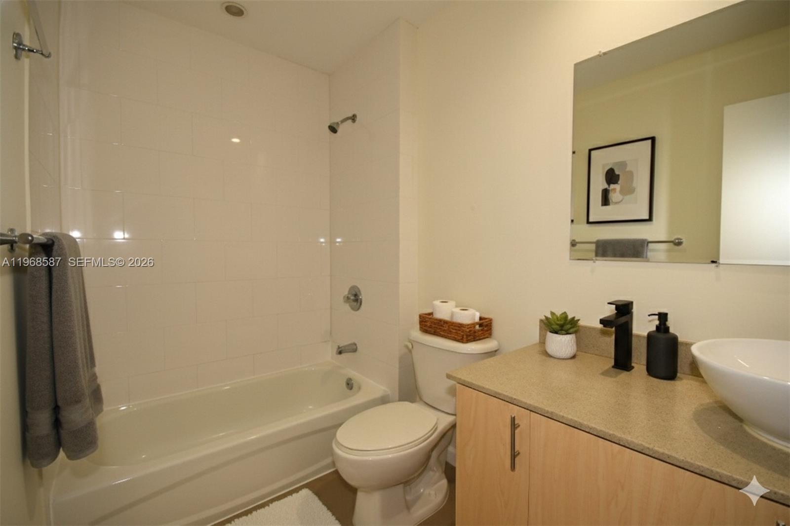 2780 Southwest 33rd Avenue Miami, FL 33133 - Photo 15 of 52 a bathroom with a sink toilet and shower