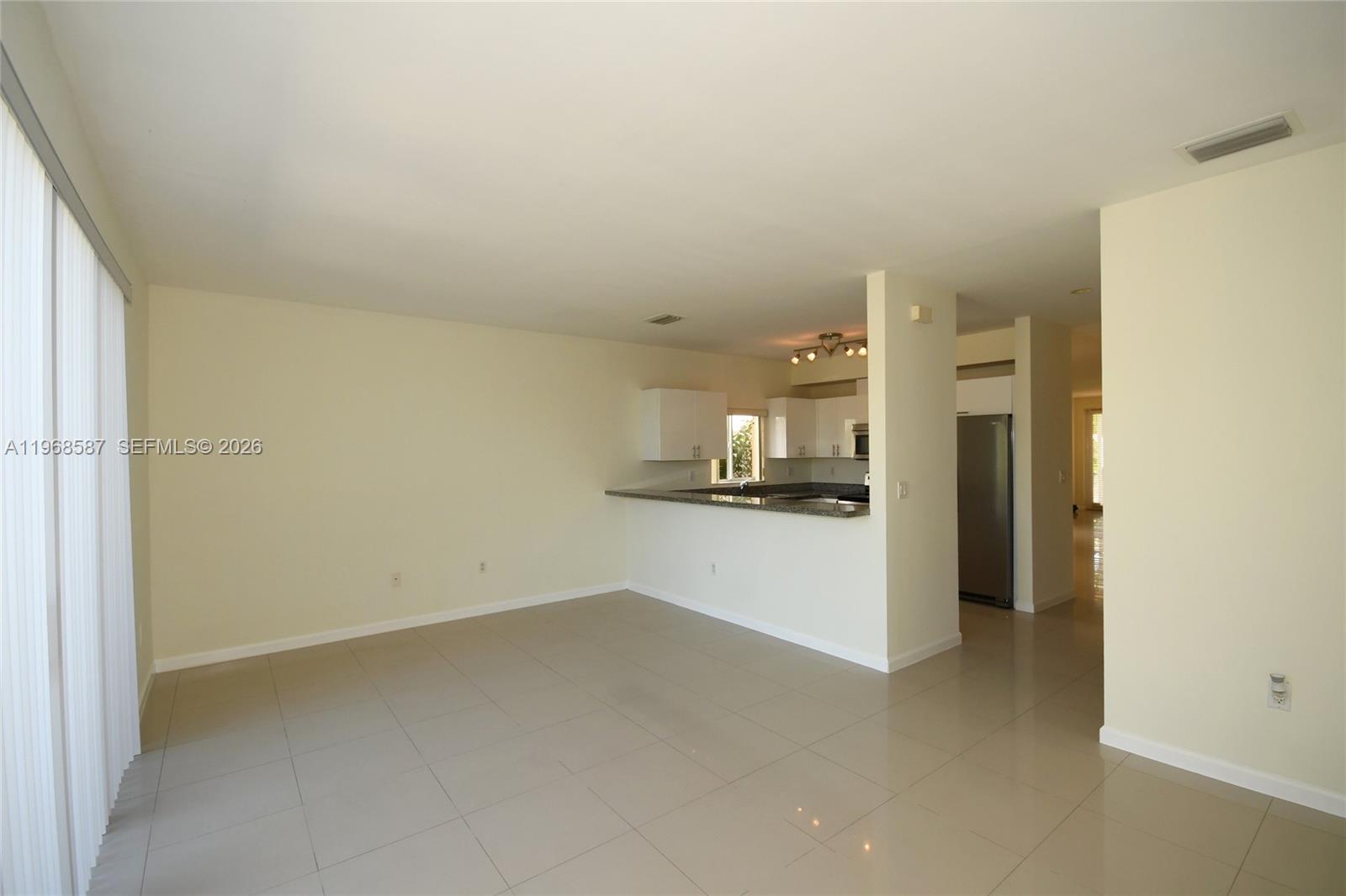 2780 Southwest 33rd Avenue Miami, FL 33133 - Photo 27 of 52 a view of a kitchen with a refrigerator and a sink