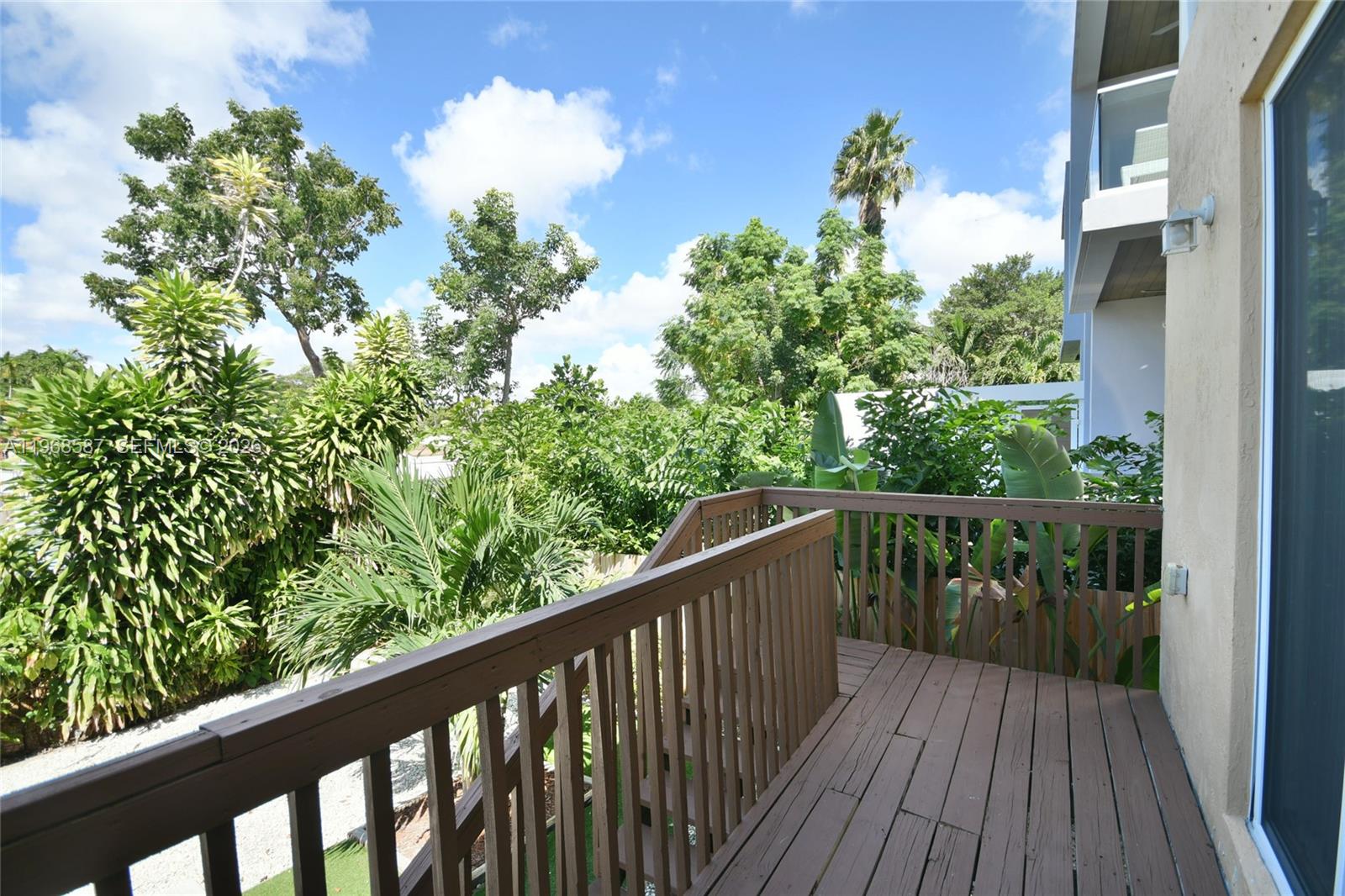 2780 Southwest 33rd Avenue Miami, FL 33133 - Photo 31 of 52 a balcony with wooden floor and outdoor space