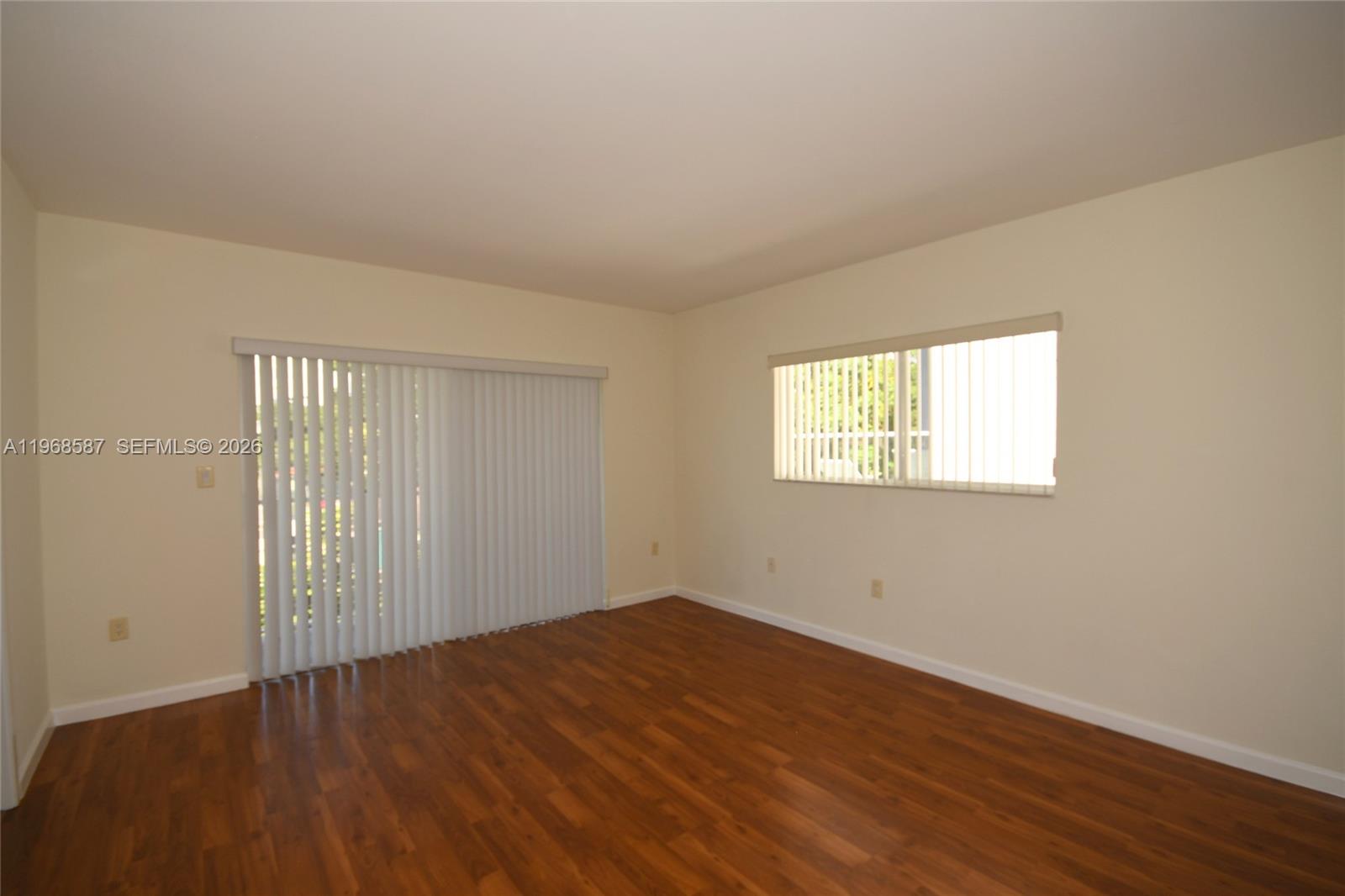 2780 Southwest 33rd Avenue Miami, FL 33133 - Photo 40 of 52 an empty room with wooden floor and windows