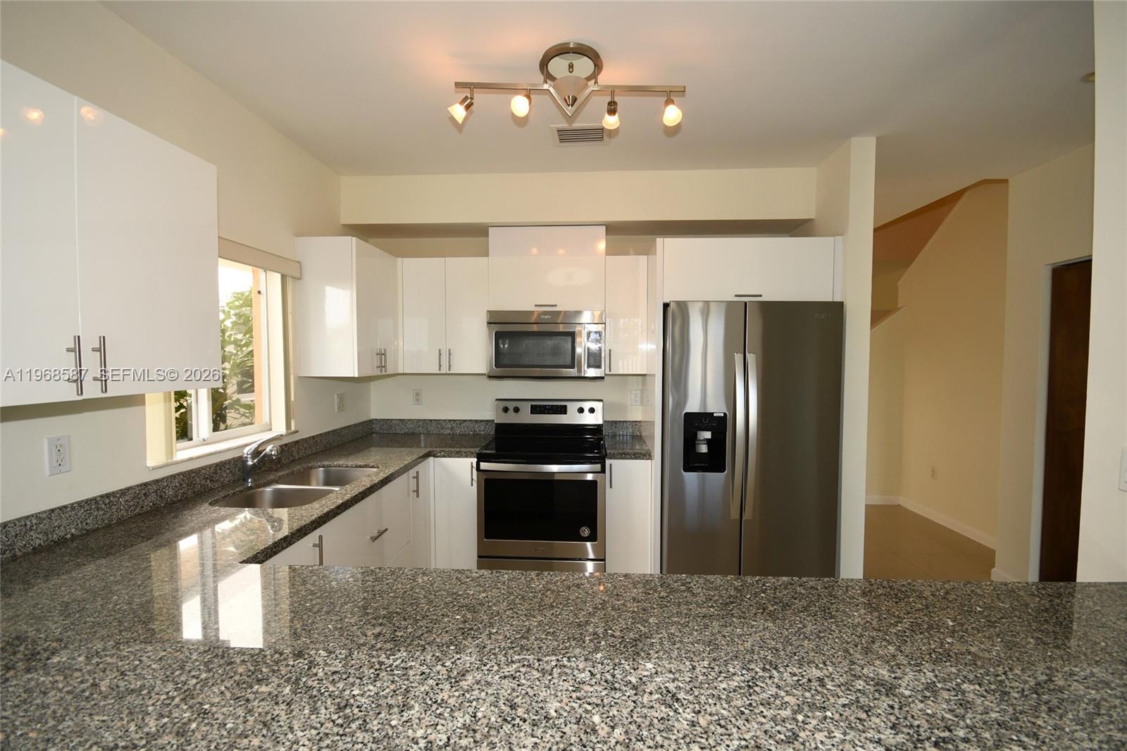 2780 Southwest 33rd Avenue Miami, FL 33133 - Photo 4 of 52 a kitchen with a refrigerator sink and stove
