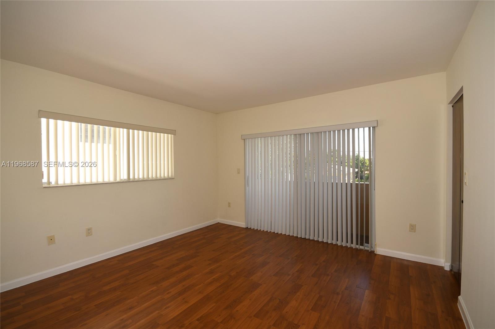 2780 Southwest 33rd Avenue Miami, FL 33133 - Photo 44 of 52 a view of an empty room with wooden floor and a window