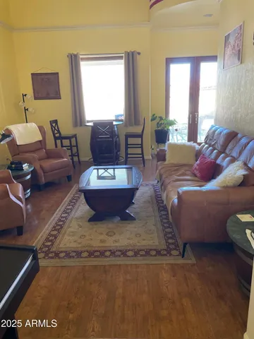 a bedroom with furniture and a chandelier