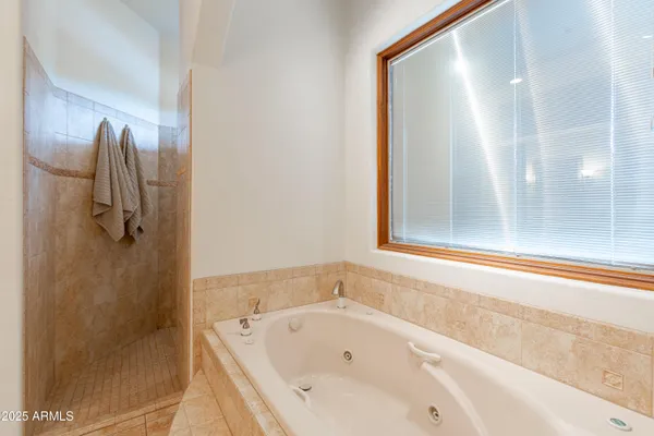 a view of a chairs and table in the patio