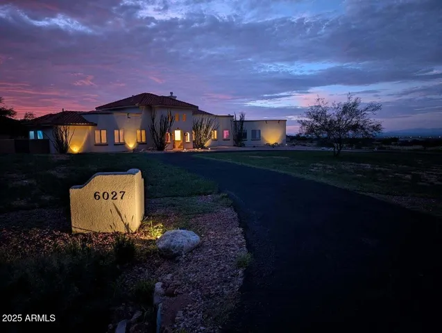 a view of living room with furniture and fireplace