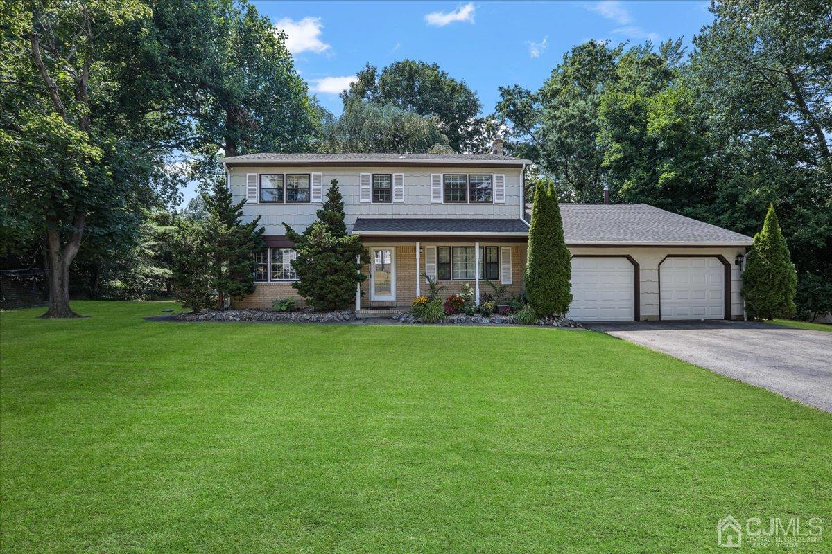 7 Timber Road East Brunswick, NJ 08816 - Photo 1 of 1 a view of a house with a backyard and a tree