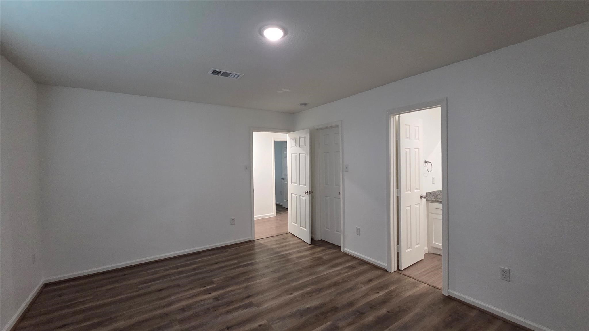 23338 Sandpiper Trail Spring, TX 77373 - Photo 11 of 11 a view of an empty room with wooden floor and closet