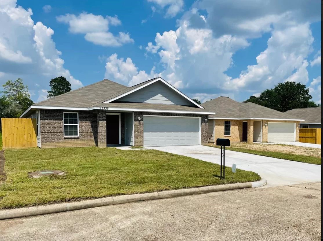 23338 Sandpiper Trail Spring, TX 77373 - Photo 2 of 11 a front view of a house with a yard