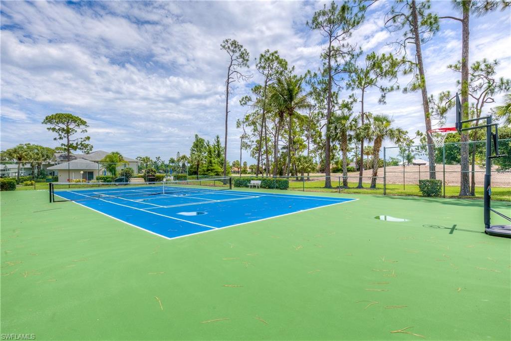 760 Augusta Boulevard, Unit D204 Naples, FL 34113 - Photo 20 of 20 a view of a playground and basketball court