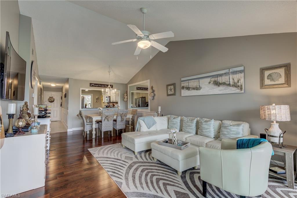 760 Augusta Boulevard, Unit D204 Naples, FL 34113 - Photo 8 of 20 a living room with furniture and wooden floor