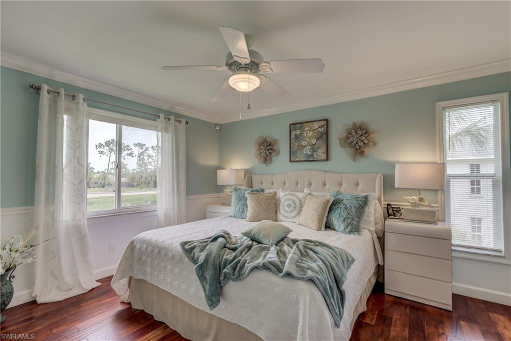 760 Augusta Boulevard, Unit D204 Naples, FL 34113 - Photo 9 of 20 a bedroom with a large bed and a window