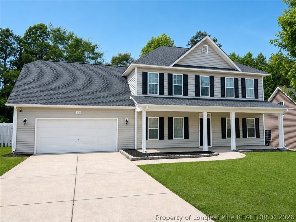 1523 Rough Rider Lane Parkton, NC 28371 - Photo 1 of 42 a front view of a house with yard