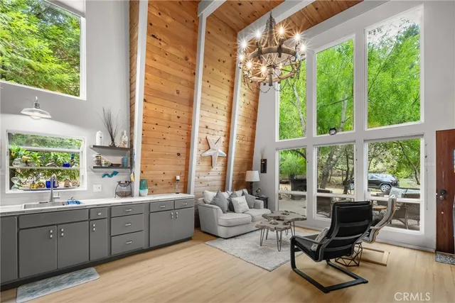 a room with lots of furniture and a large window