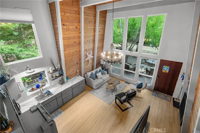 a bedroom with furniture and a large window