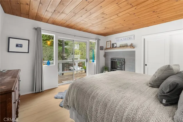 a spacious bedroom with a bed and a fireplace