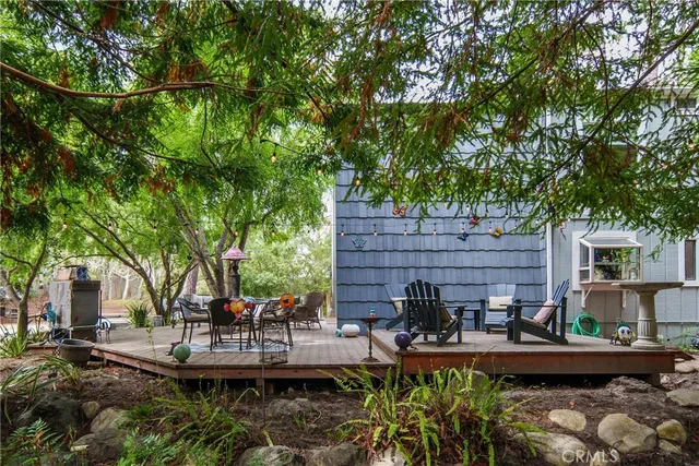 a view of house with outdoor space and sitting area