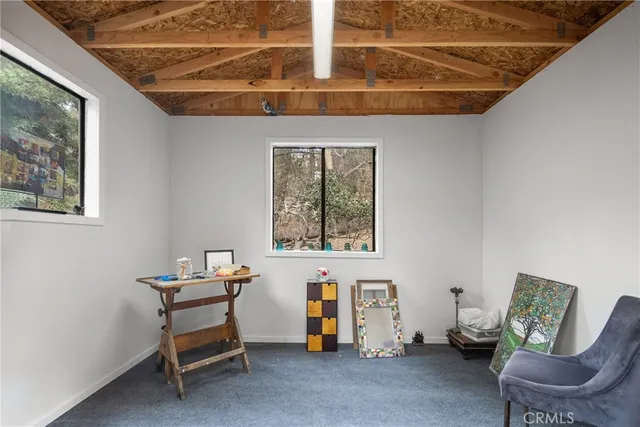 a view of a livingroom with furniture and windows