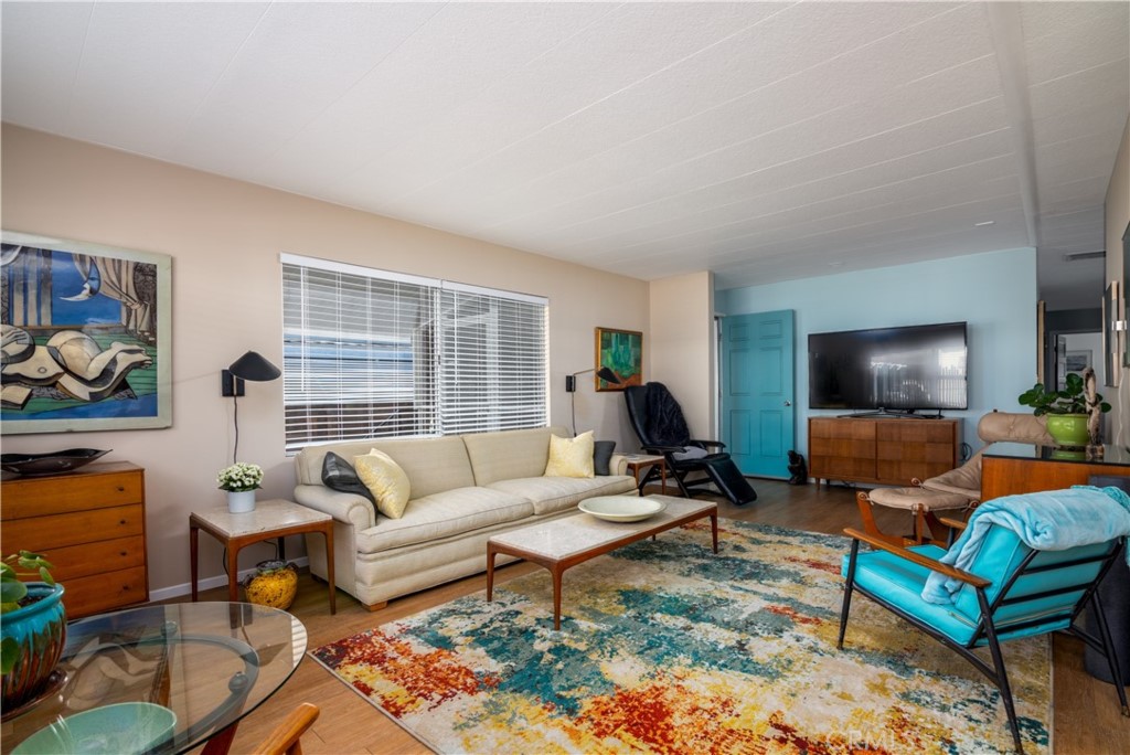 4747 Oak Crest Road, Unit 31 Fallbrook, CA 92028 - Photo 1 of 1 a living room with furniture and a flat screen tv