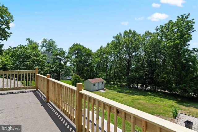 a view of a wooden deck and garden