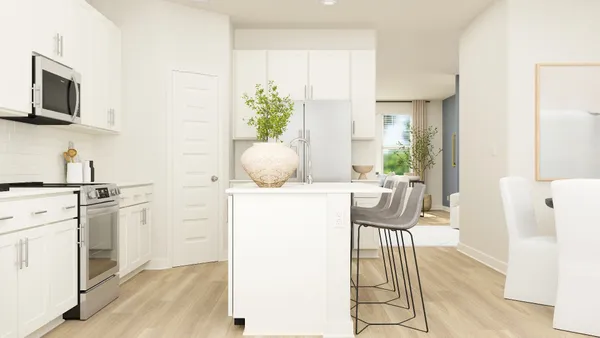 a view of kitchen with furniture and wooden floor