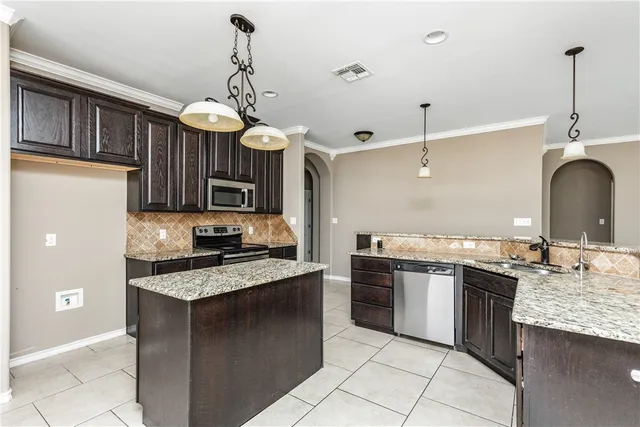 a kitchen with a stove and a table