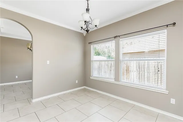 a view of a big room with wooden floor and a ceiling fan