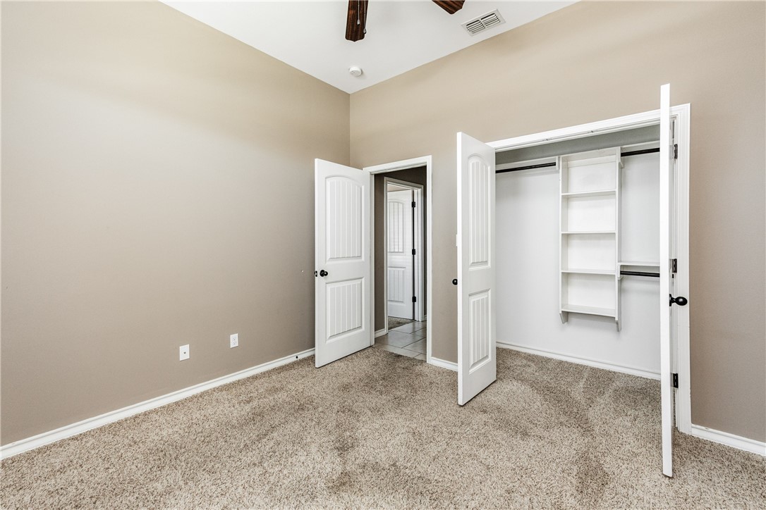 8221 Azimuth Court Corpus Christi, TX 78414 - Photo 29 of 40 an empty room with closet and windows