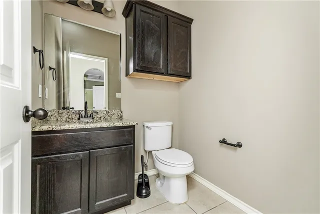 a view of a closet with wooden floor