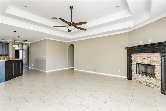 a view of an empty room with a fireplace