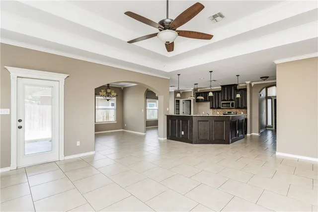 a large kitchen with cabinets and stainless steel appliances