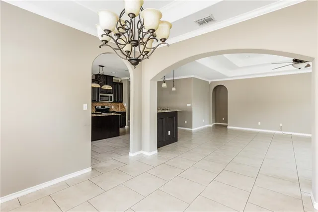 a kitchen with stainless steel appliances granite countertop a stove and a sink