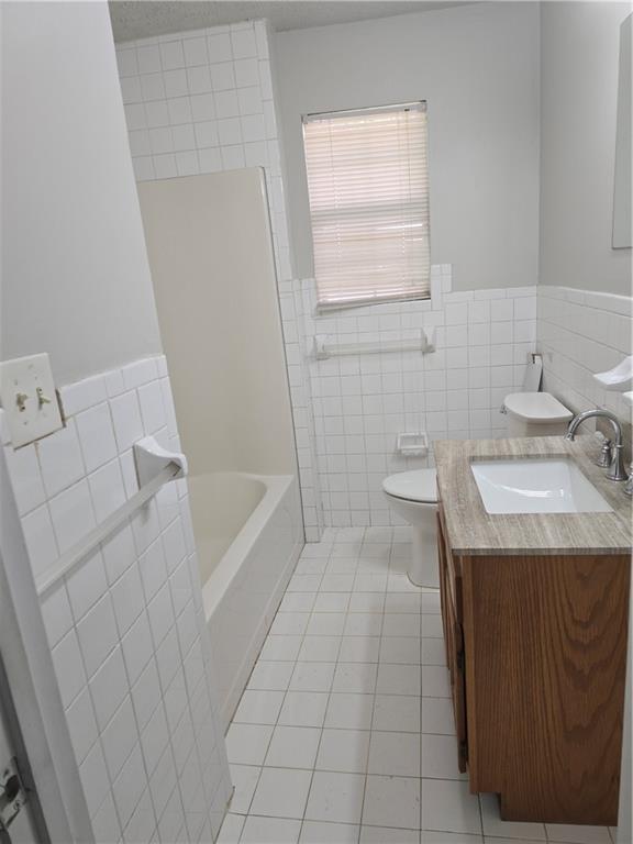 3725 Collier Drive Northwest Atlanta, GA 30331 - Photo 19 of 31 a bathroom with a sink a toilet and shower