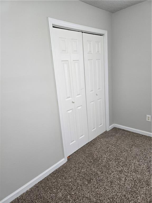 3725 Collier Drive Northwest Atlanta, GA 30331 - Photo 21 of 31 an empty room with a wooden door