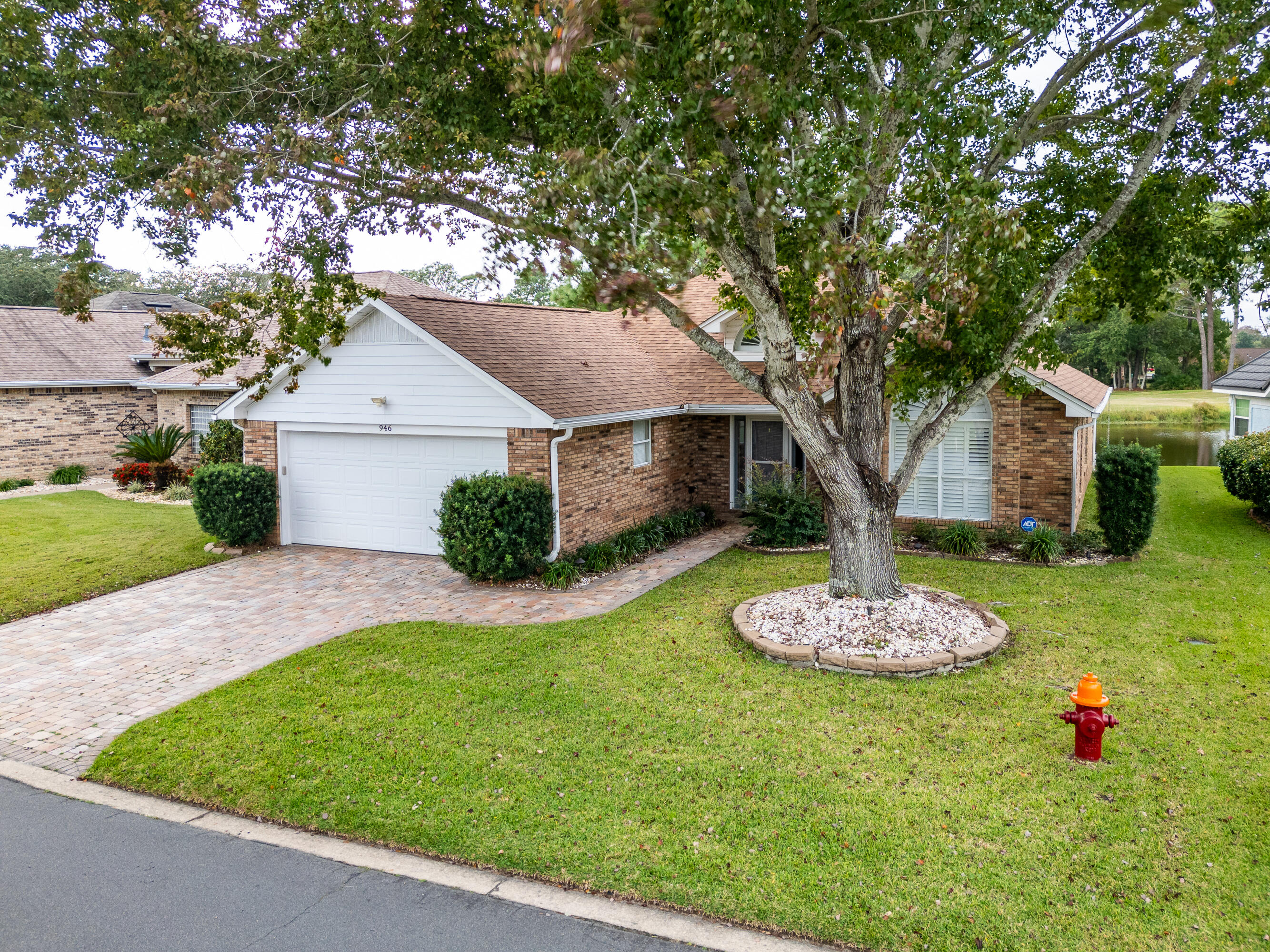 946 Shalimar Point Drive Shalimar, FL 32579 - Photo 11 of 63 a front view of a house with a garden and plants