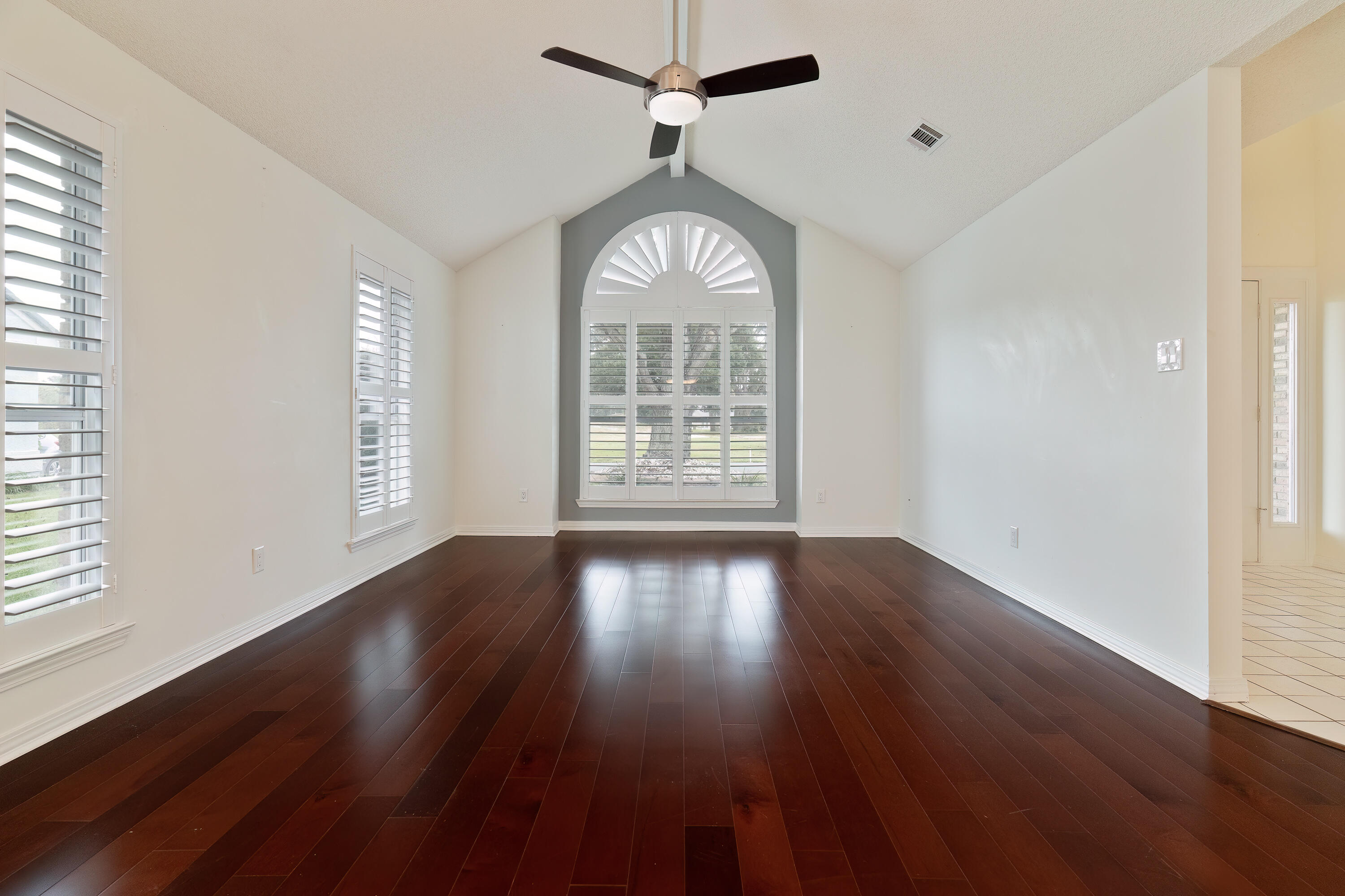 946 Shalimar Point Drive Shalimar, FL 32579 - Photo 13 of 63 a view of an empty room with wooden floor and a window